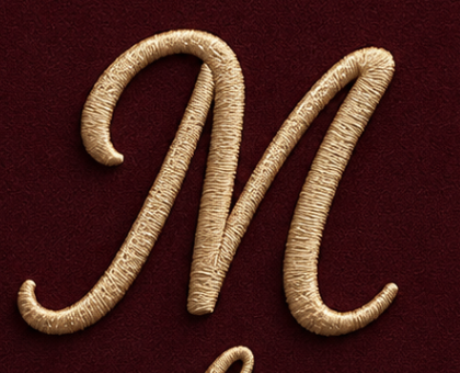 The MOHUMI cursive M monogram